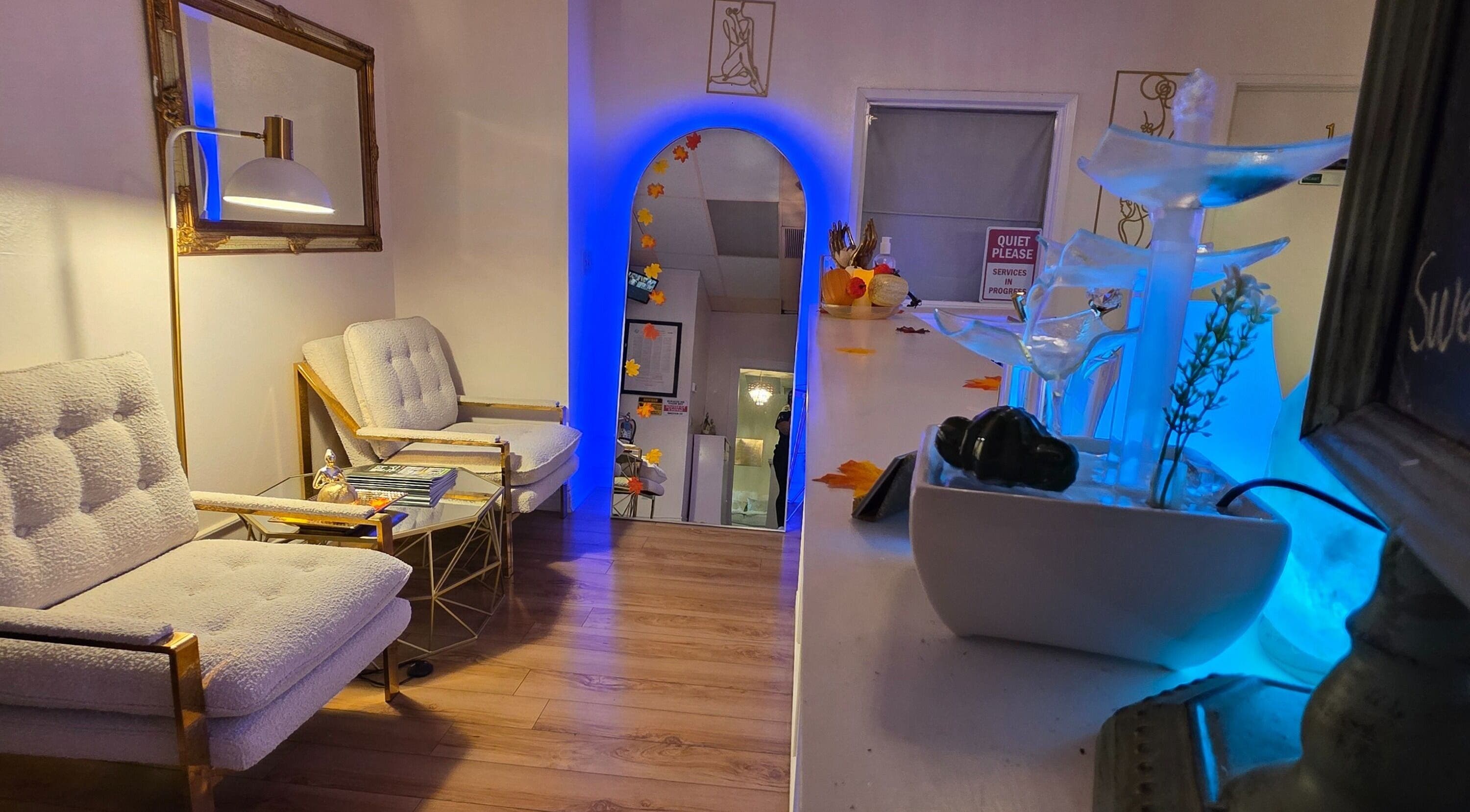 Elegant waiting area at Skin Gallery Spa in Los Angeles, California, US with plush seating and modern decor.