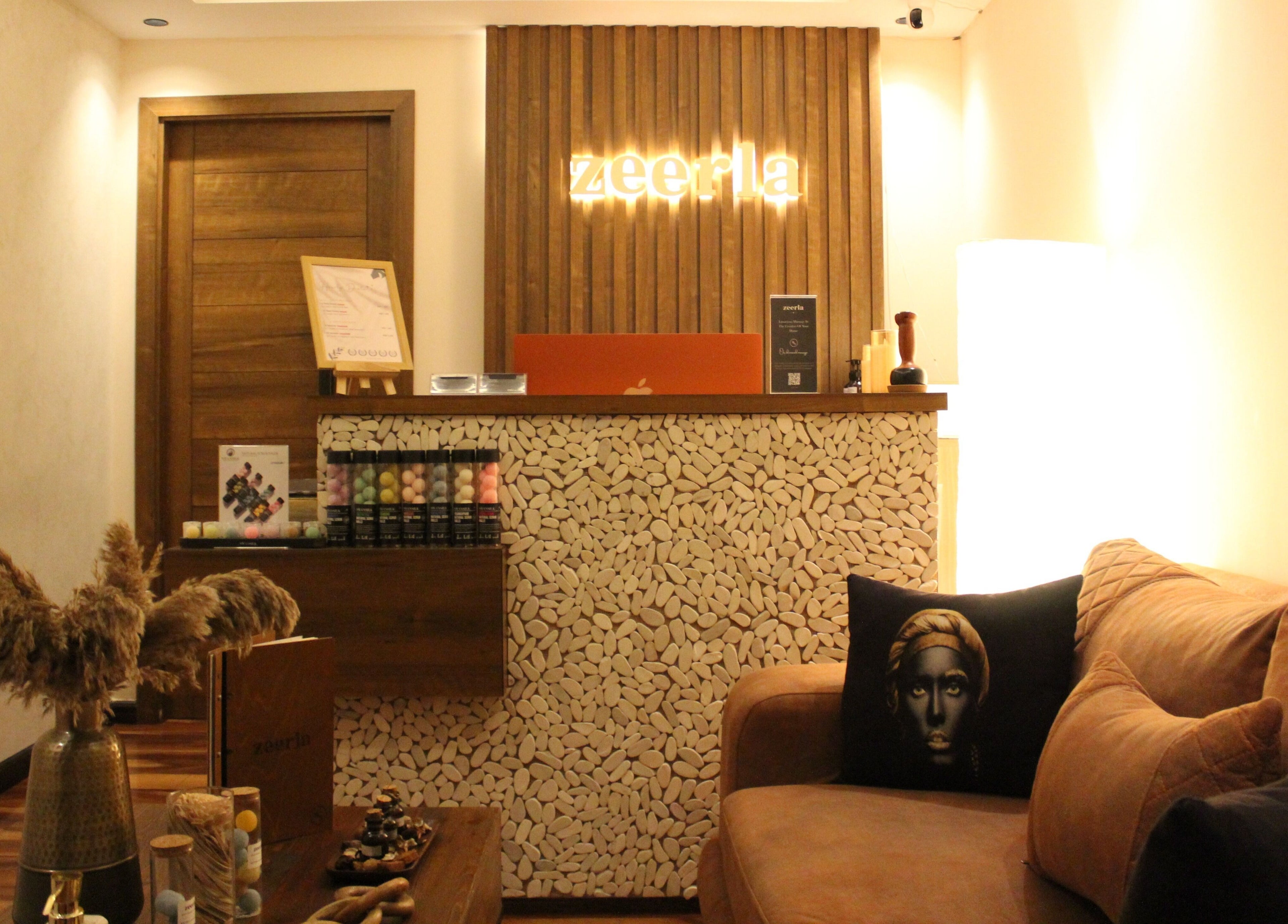 Cozy reception at Zeerla Spa Media City, Dubai Media City, دبي, AE with elegant decor and warm lighting.