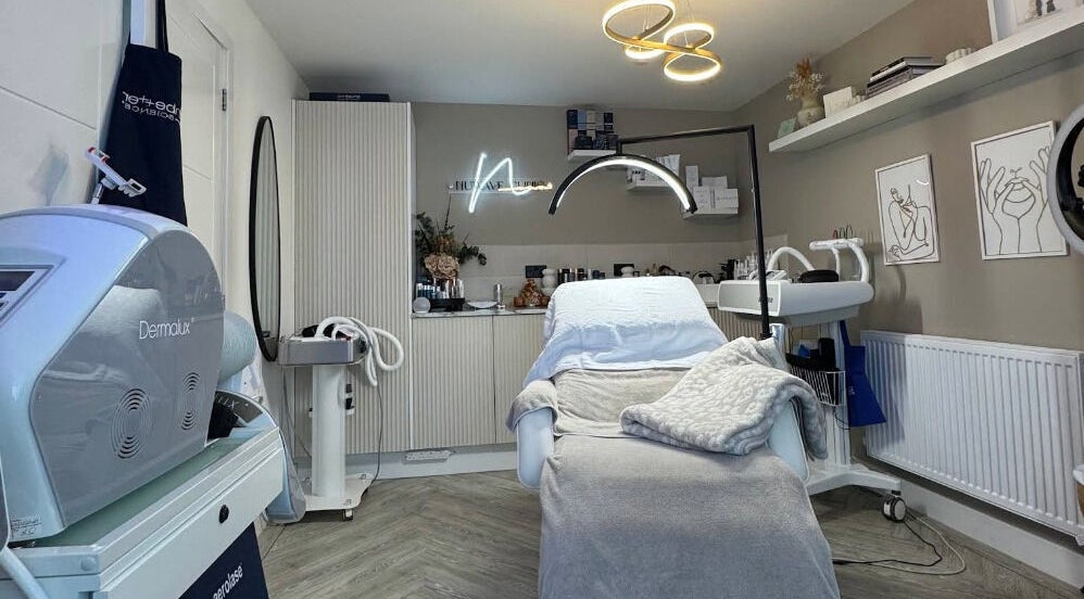 Modern therapy room at NuWave Clinic, Paignton, England, GB, featuring reclining chair and advanced equipment.