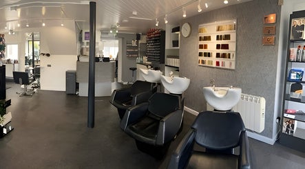 Modern interior of The Hive Hair • Beauty in St Austell, showcasing sleek salon chairs and decor.