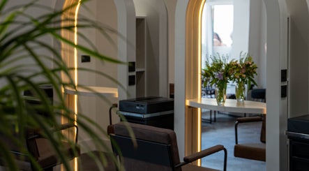Elegant salon interior with floral decor at The Hive Hair • Beauty in St Austell, England, GB.