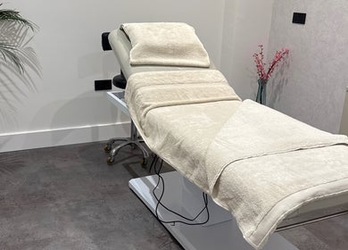 Relaxing treatment room at The Hive Hair Beauty in St Austell, England, GB with a plush bed and serene decor.
