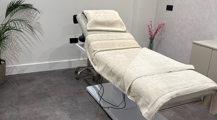 Relaxing treatment room at The Hive Hair Beauty in St Austell, England, GB with a plush bed and serene decor.