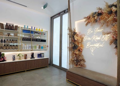 Stylish product showcase at Legend Beauty Centre, Dubai, Dubai, AE with decorative floral accents.