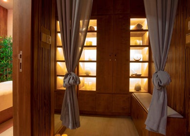 Tranquil spa room at Legend Beauty Centre, Dubai, Dubai, AE, featuring elegant wood decor and soft lighting.