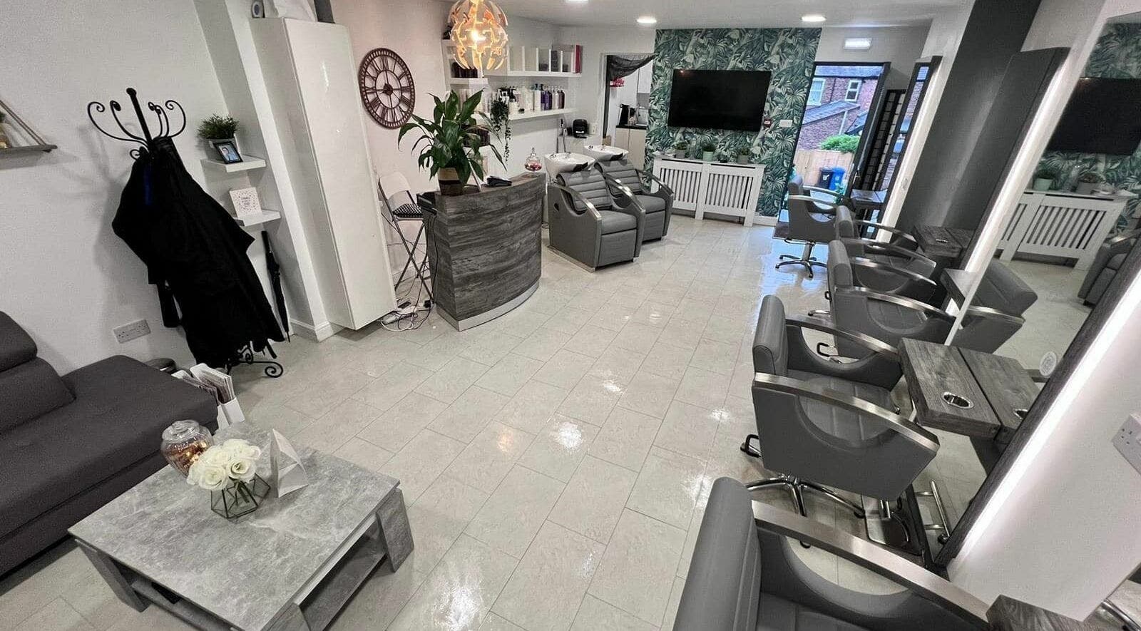 Modern salon space at Preen Hair and Cosmetics Ltd, Warrington, England, GB, showcasing stylish seating and decor.
