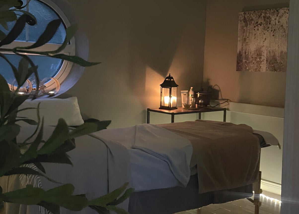 Peaceful treatment room at Ukiyo Holistic Center, Omagh, Northern Ireland, GB, with soft lighting and decor.