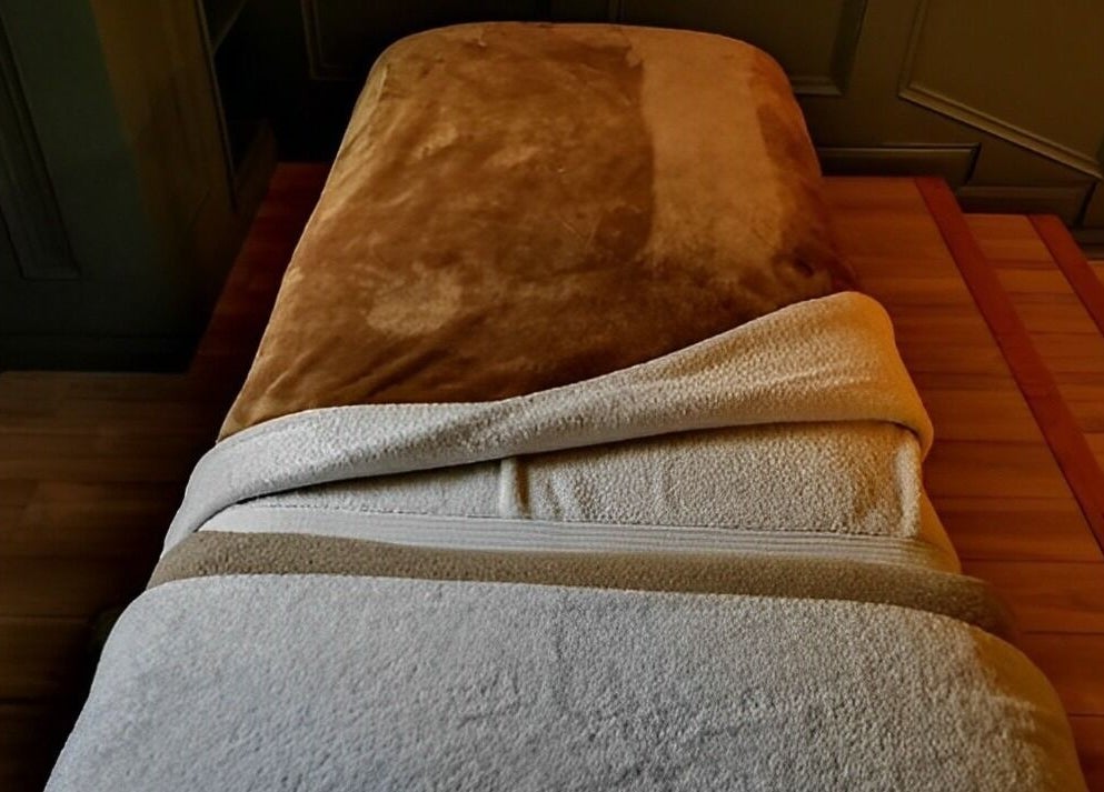 Comfortable massage bed at Ukiyo Holistic Center, Omagh, Northern Ireland, GB, offering serene wellness.