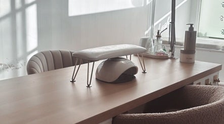 Manicure station at The Nail Jar in Barnstaple, England, GB, featuring stylish furniture and a serene ambiance.