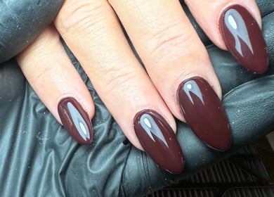Elegant dark red nails showcased at The Nail Jar, Barnstaple, England, GB.