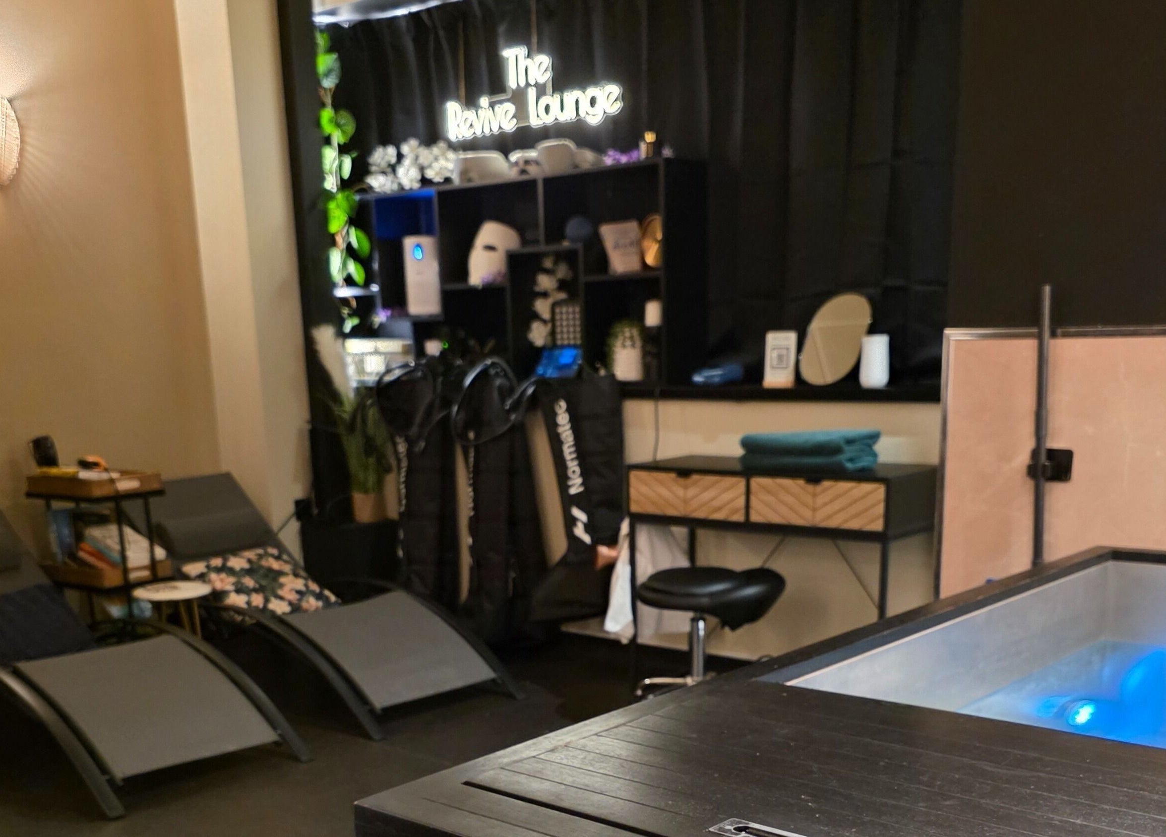 Relaxing lounge area at The Wellness Lounge, Cardiff, Wales, GB featuring spa amenities and seating.