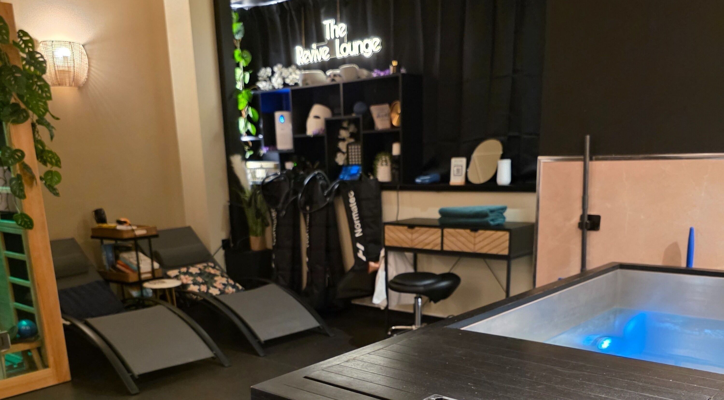 Relaxing lounge area at The Wellness Lounge, Cardiff, Wales, GB featuring spa amenities and seating.