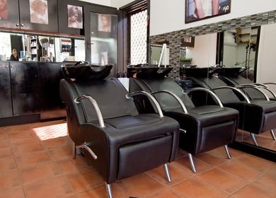 Elegant salon interior at Creations by Linda in Melbourne, Victoria, AU featuring modern styling chairs.