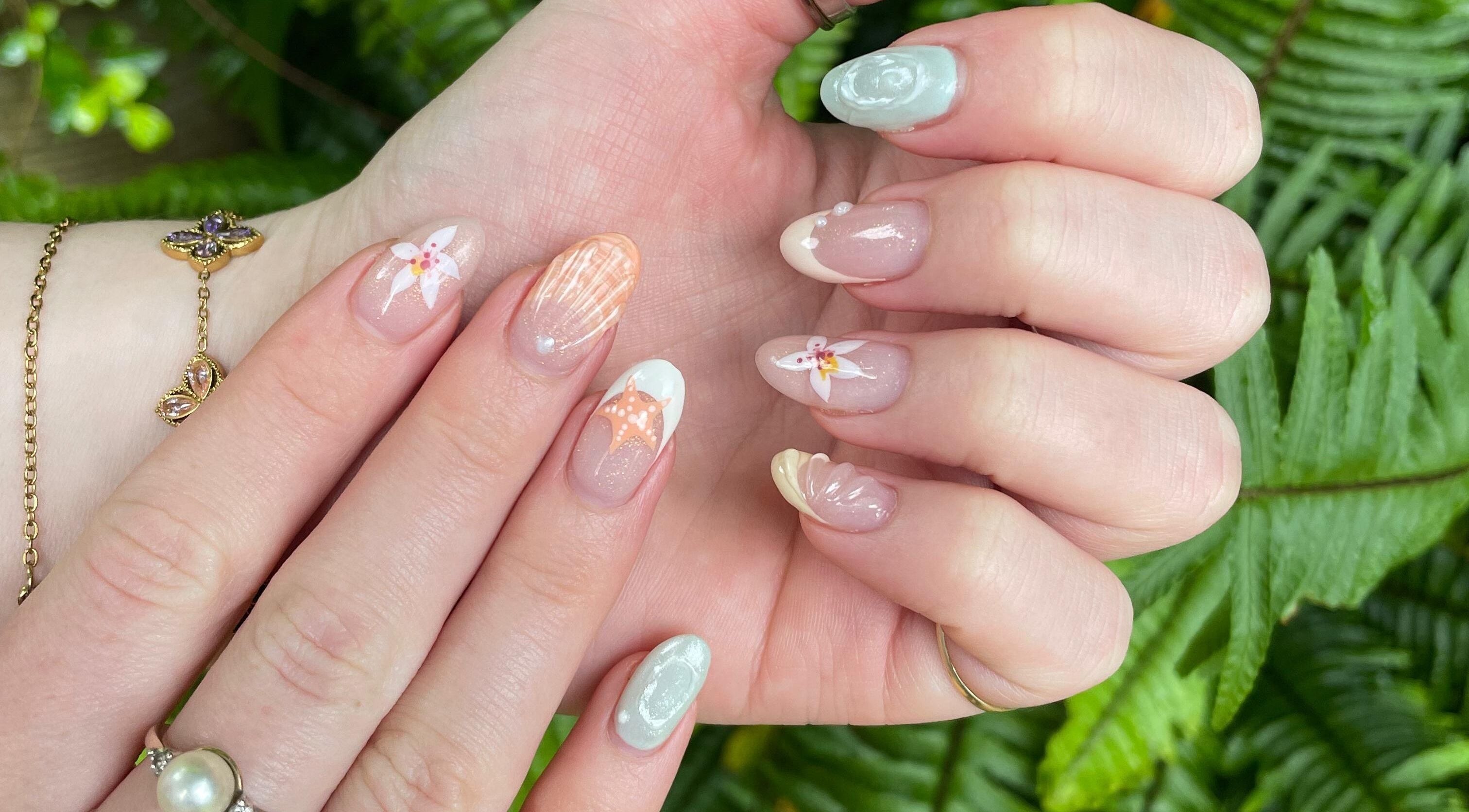 Artistic nail design with floral motifs at Adorn Salon in Durban, KwaZulu-Natal, ZA.