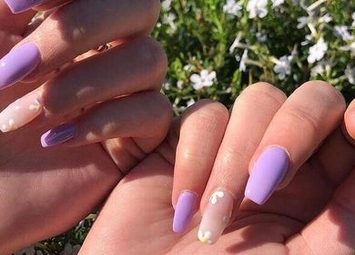 Lavender manicured nails with floral accents at Adorn Salon, Durban, KwaZulu-Natal, ZA.