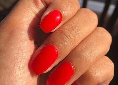 Vibrant red manicure at Adorn Salon, Durban, KwaZulu-Natal, ZA, capturing elegance and style.