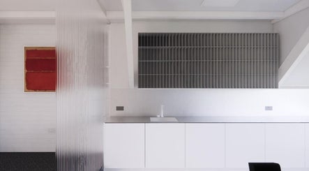 SALT Salon Borough's sleek modern interior in London, England, GB, featuring minimalist decor and art.