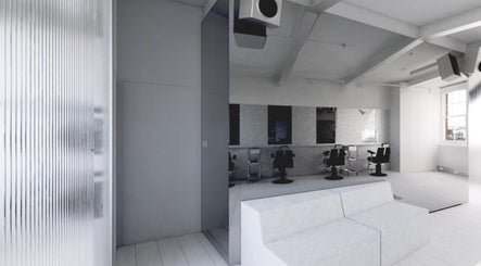 Minimalist interior of SALT Salon Borough with sleek chairs and mirrors in London, England, GB.