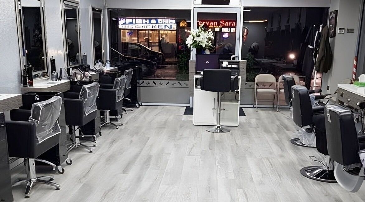 Interior of Terry’s Barbers & Hairdressers in Romford, England, GB featuring modern chairs and sleek design.