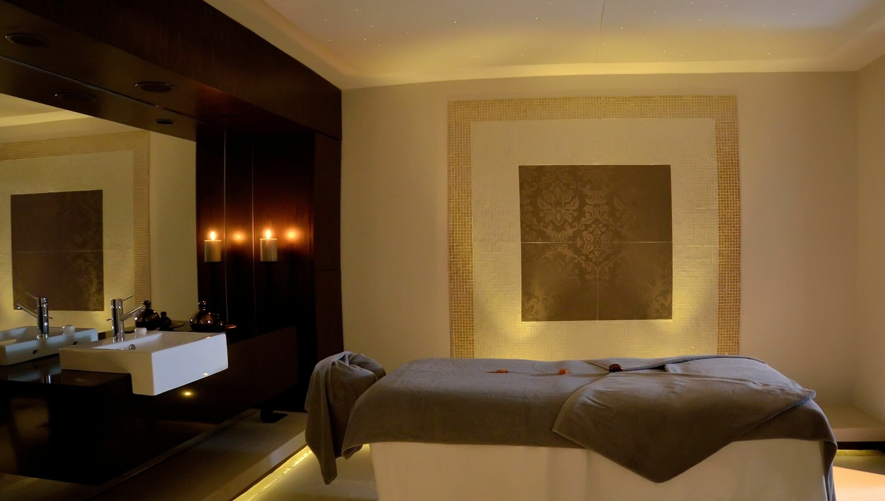Luxurious spa room at The Residence Mauritius, Flacq District, MU, showcasing a tranquil massage bed.
