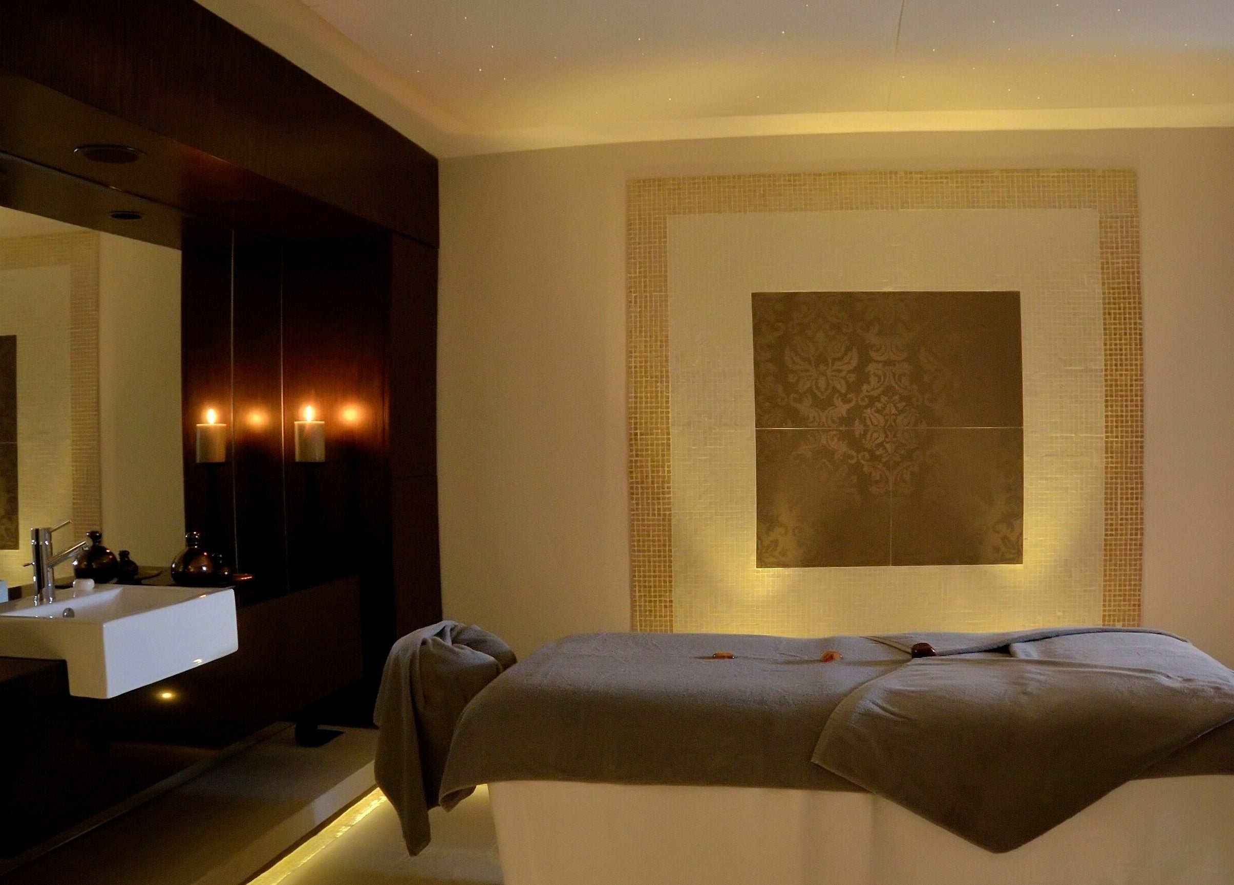 Luxurious spa room at The Residence Mauritius, Flacq District, MU, showcasing a tranquil massage bed.