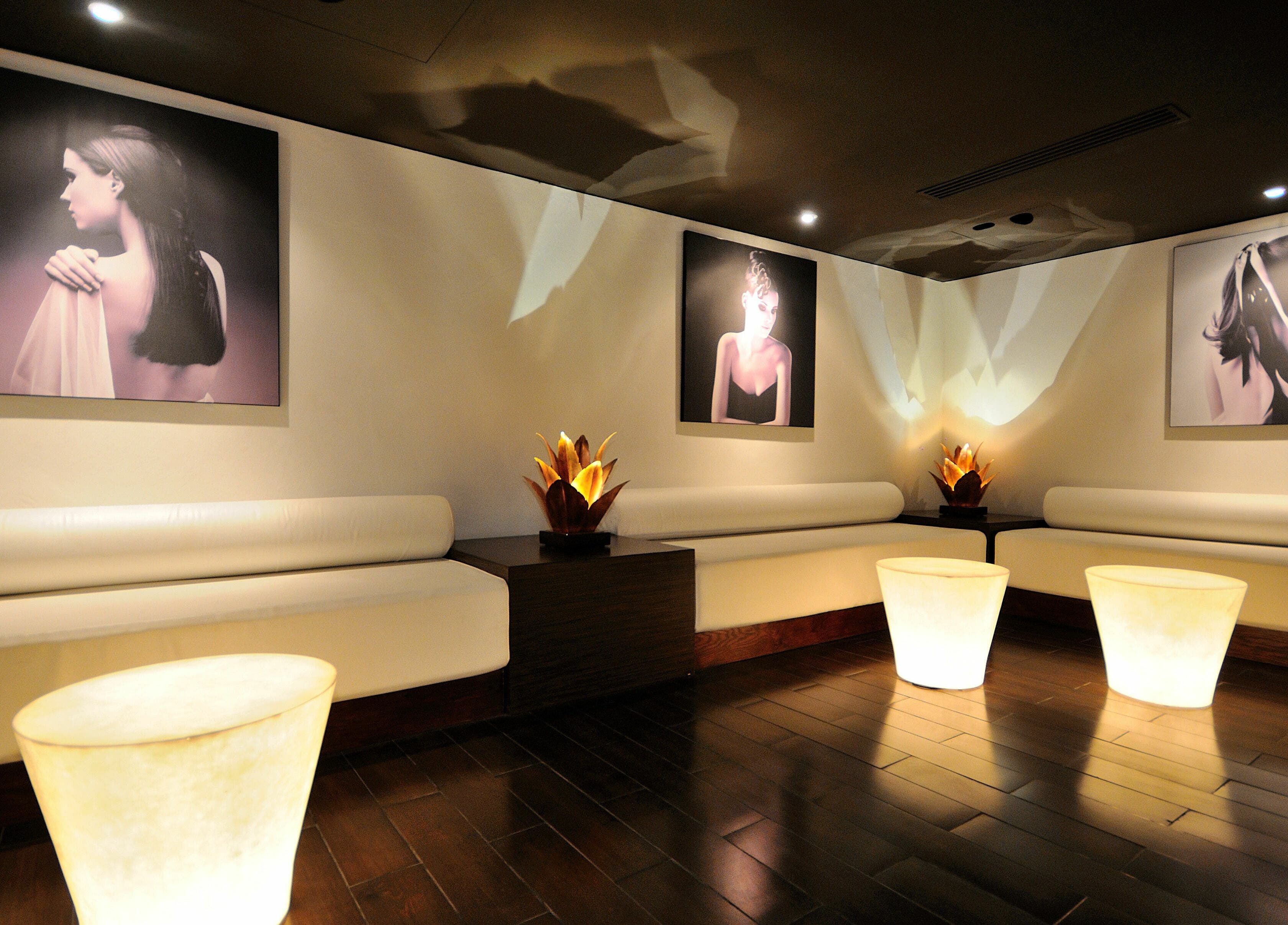 Elegant spa lounge with art at The Residence Mauritius, Flacq District, MU. Cozy ambiance and decor.
