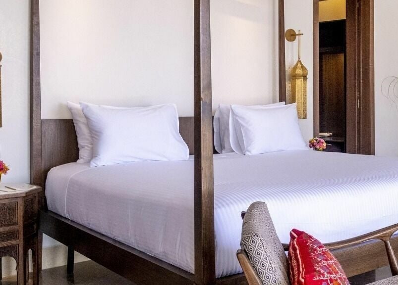 Luxurious bedroom at The Residence Mauritius, Flacq District, MU featuring elegant decor and cozy bedding.