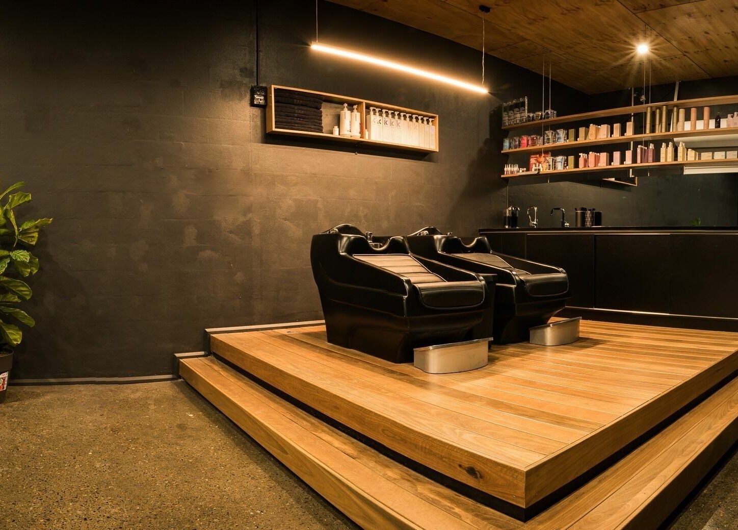 Elegant salon chairs and shelves at Stable Space, Miami, Queensland, AU, offering a tranquil beauty experience.