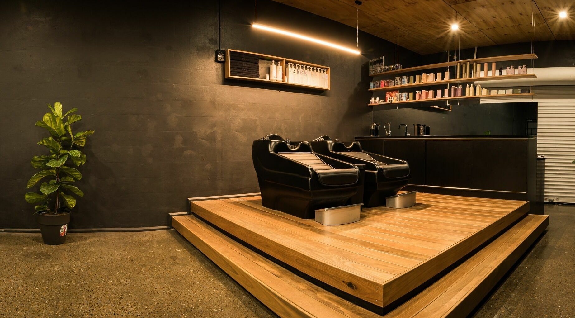 Elegant salon chairs and shelves at Stable Space, Miami, Queensland, AU, offering a tranquil beauty experience.