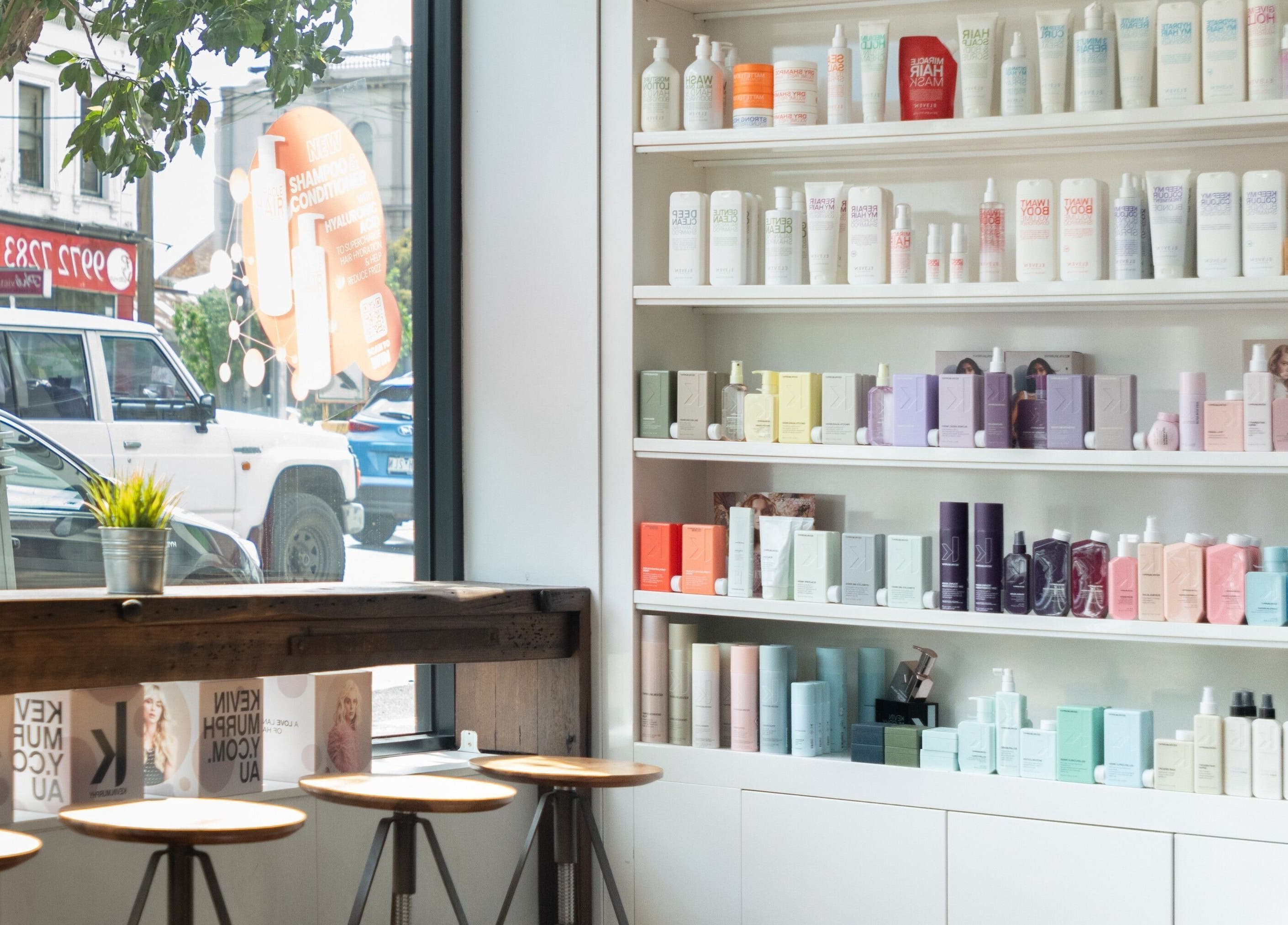 Sleek hair product shelves at Moscato Hair, West Melbourne, VIC, AU showcasing premium beauty brands.