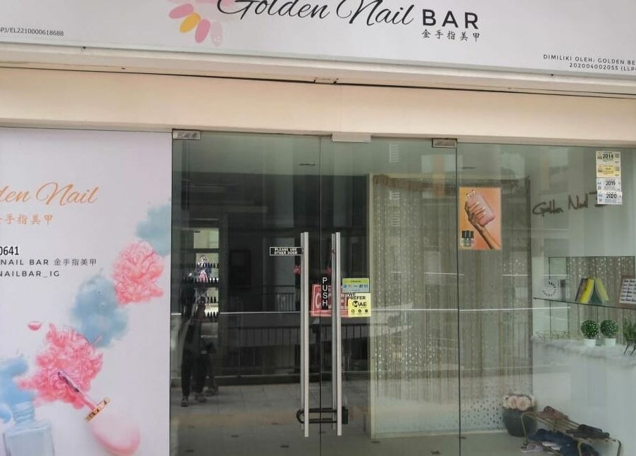 Front entrance of Golden Beauty Nail Bar in Petaling Jaya, Selangor, MY with stylish glass doors.