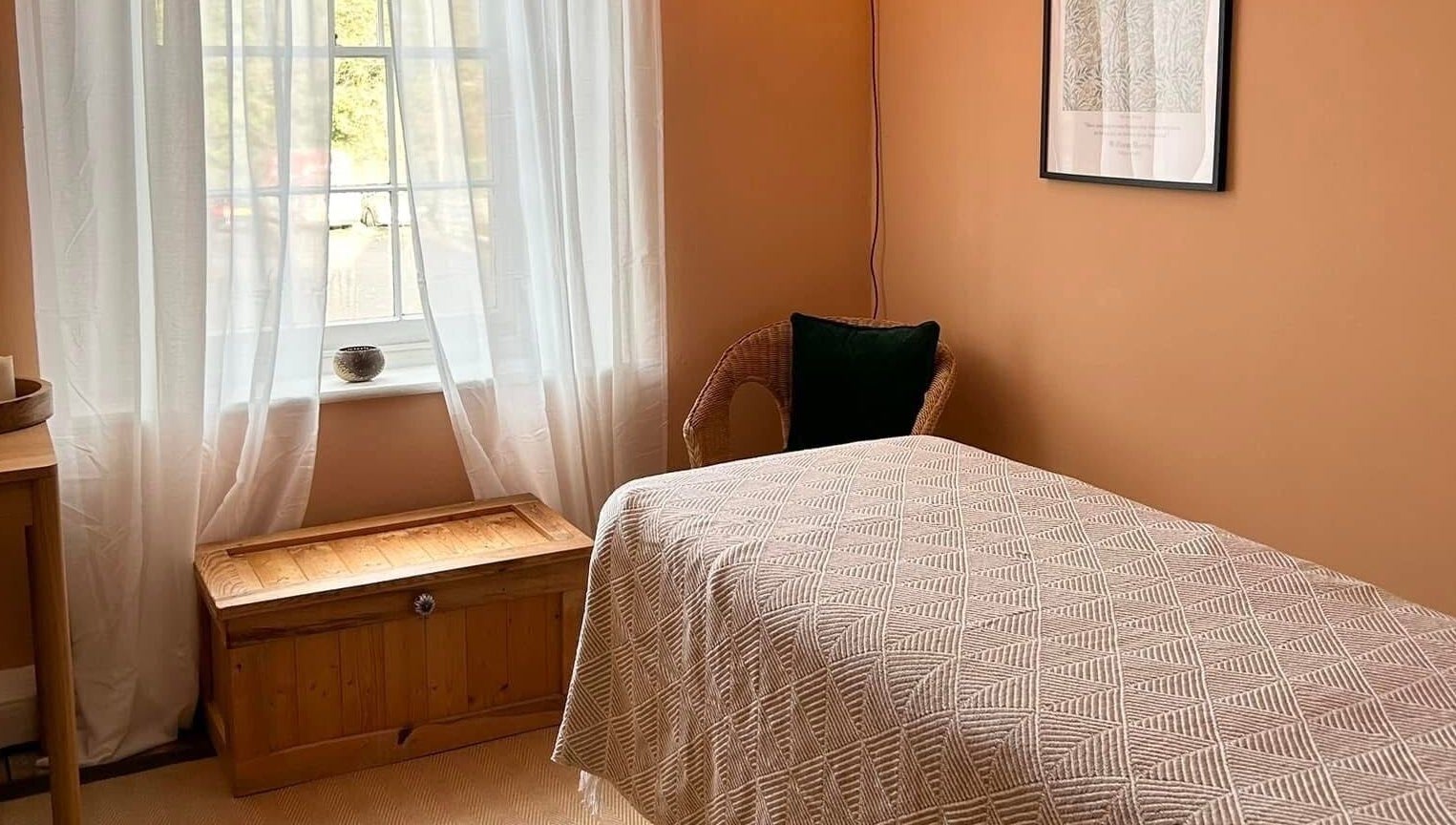 Relaxing room at Rewild Reflexology - Frome, featuring a cozy bed and soft lighting in Frome, England, GB.