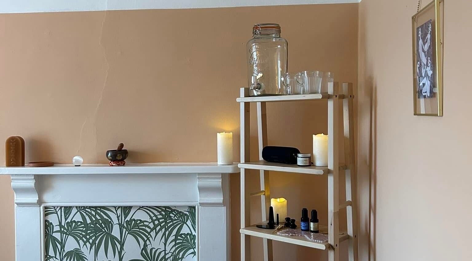 Cozy corner with candles and wellness items at Rewild Reflexology - Frome, in Frome, England, GB.