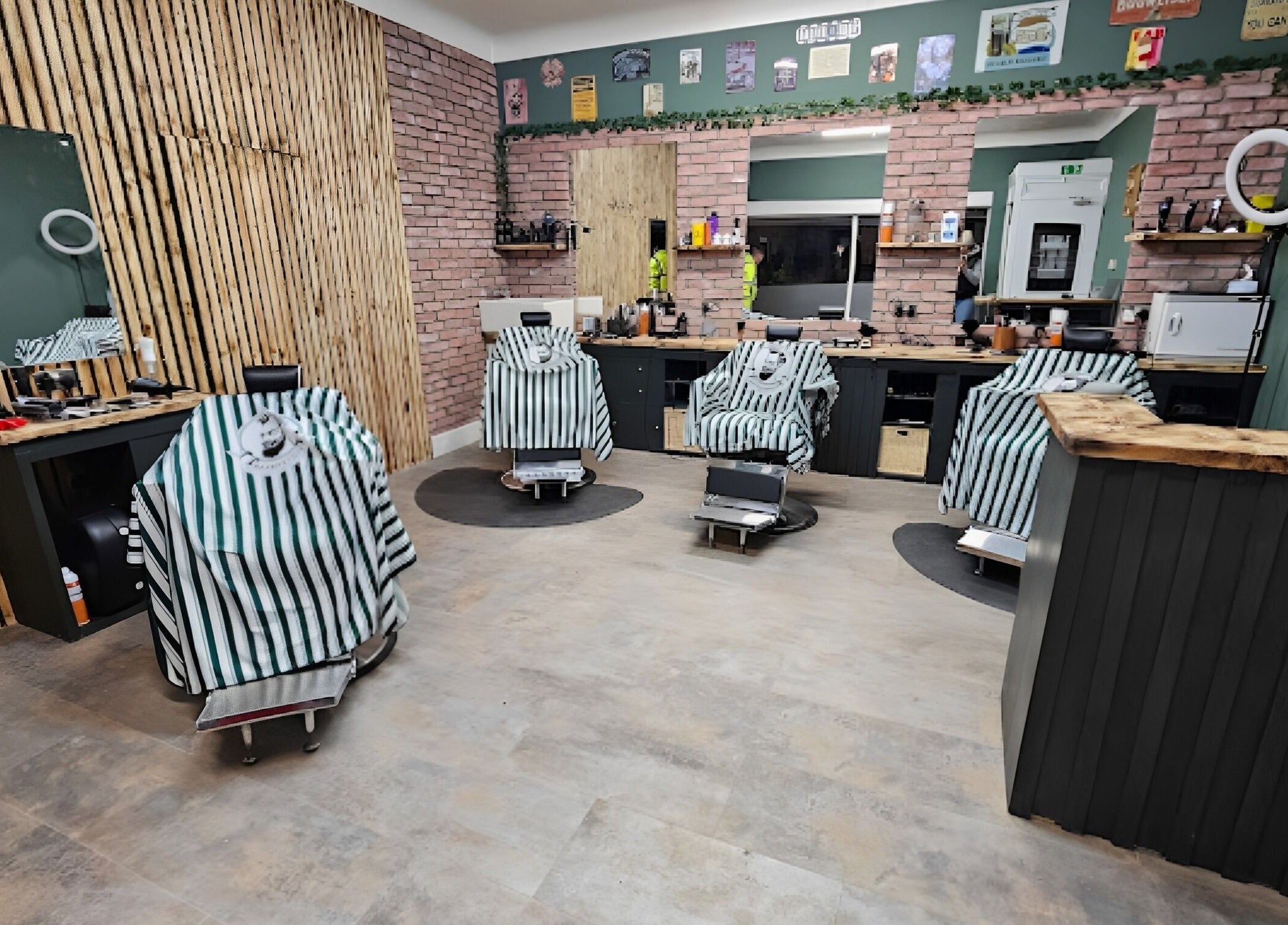 Sleek interior of Prestige Barbers in Bebington, England with modern chairs and rustic decor.