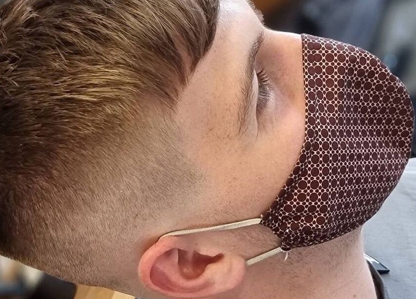Close-up of a sharp fade haircut at Prestige Barbers, Bebington, England, GB. Modern grooming style with attention to detail.