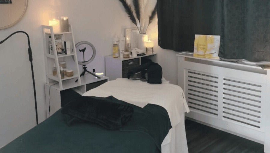 Cozy Skinsense spa room in Crawley, England with massage bed and soothing decor.