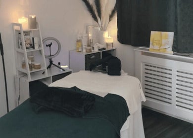 Cozy Skinsense spa room in Crawley, England with massage bed and soothing decor.