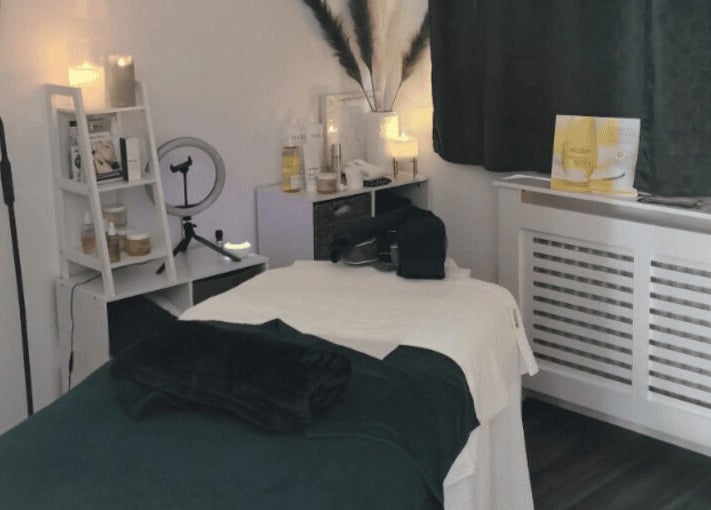 Cozy Skinsense spa room in Crawley, England with massage bed and soothing decor.