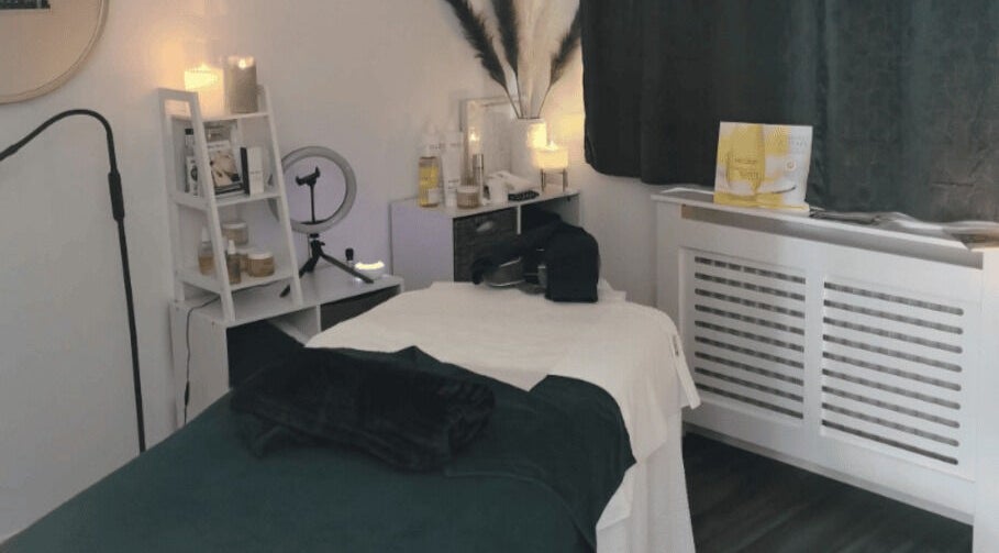 Cozy Skinsense spa room in Crawley, England with massage bed and soothing decor.