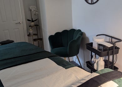 Elegant treatment room at Skinsense, Crawley, England, GB, featuring a plush chair and neatly organized supplies.