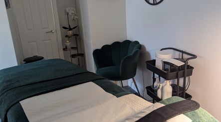 Elegant treatment room at Skinsense, Crawley, England, GB, featuring a plush chair and neatly organized supplies.