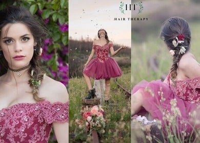 Elegant woman in floral dress at Hair Therapy Knysna, Knysna, Western Cape, ZA, embodying bohemian style.