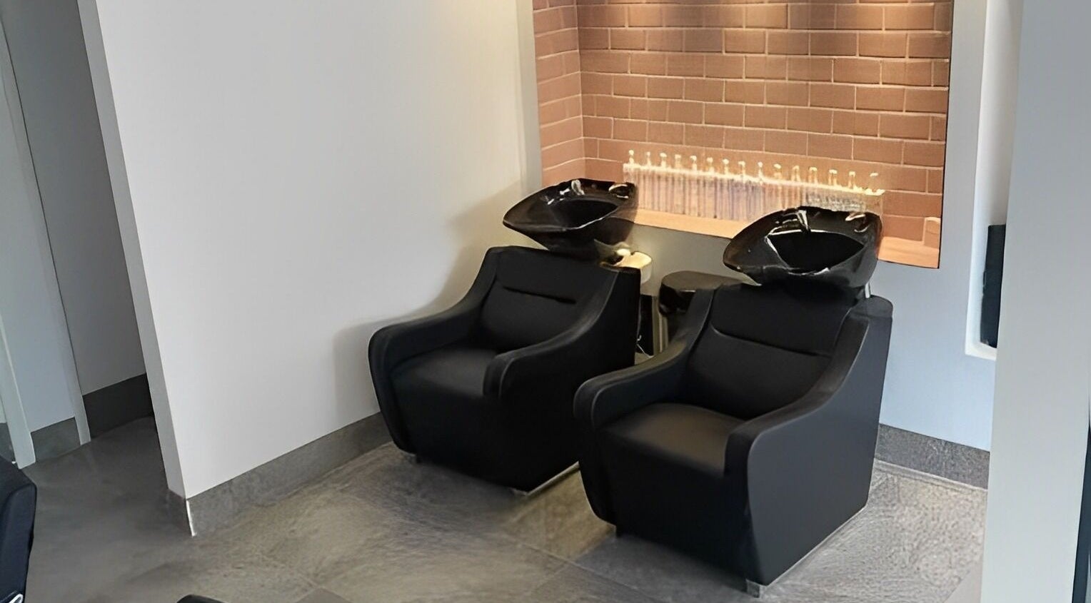 Sleek hair wash stations at Ego Hairdressing, Milngavie, Scotland, GB. Modern salon interior design.