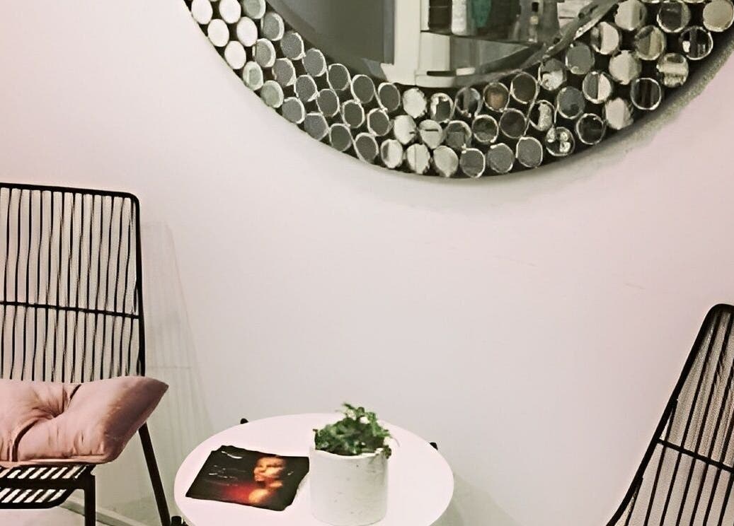 Stylish seating area with modern chairs at Beauty on Main, Main Beach, Queensland, AU.