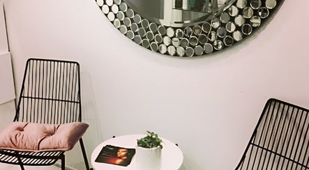 Stylish seating area with modern chairs at Beauty on Main, Main Beach, Queensland, AU.