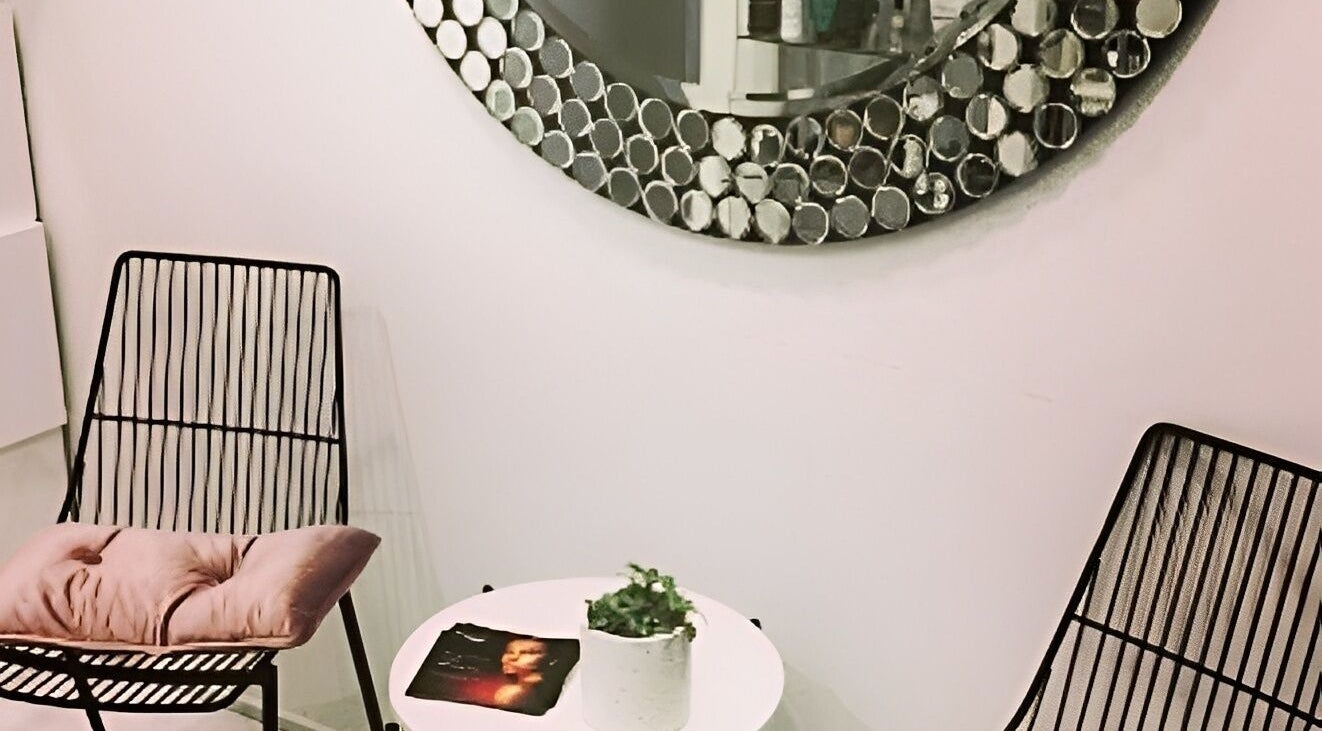 Stylish seating area with modern chairs at Beauty on Main, Main Beach, Queensland, AU.