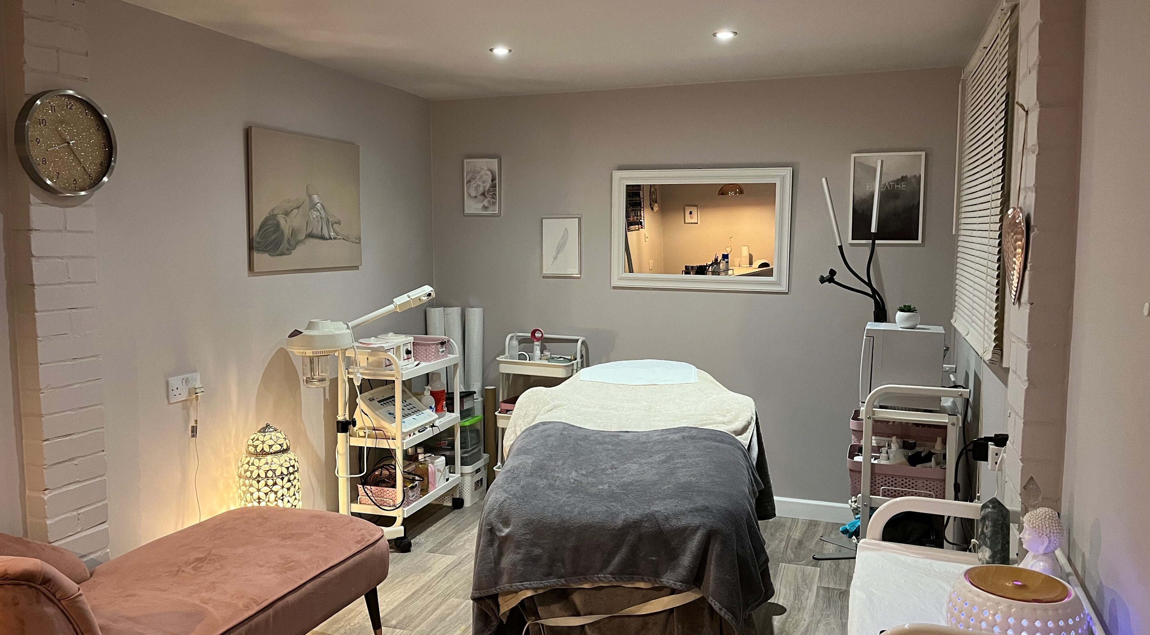 A tranquil treatment room at Amy Webb Beauty Therapy, Thruxton, England, GB. Featuring a massage bed and elegant decor.