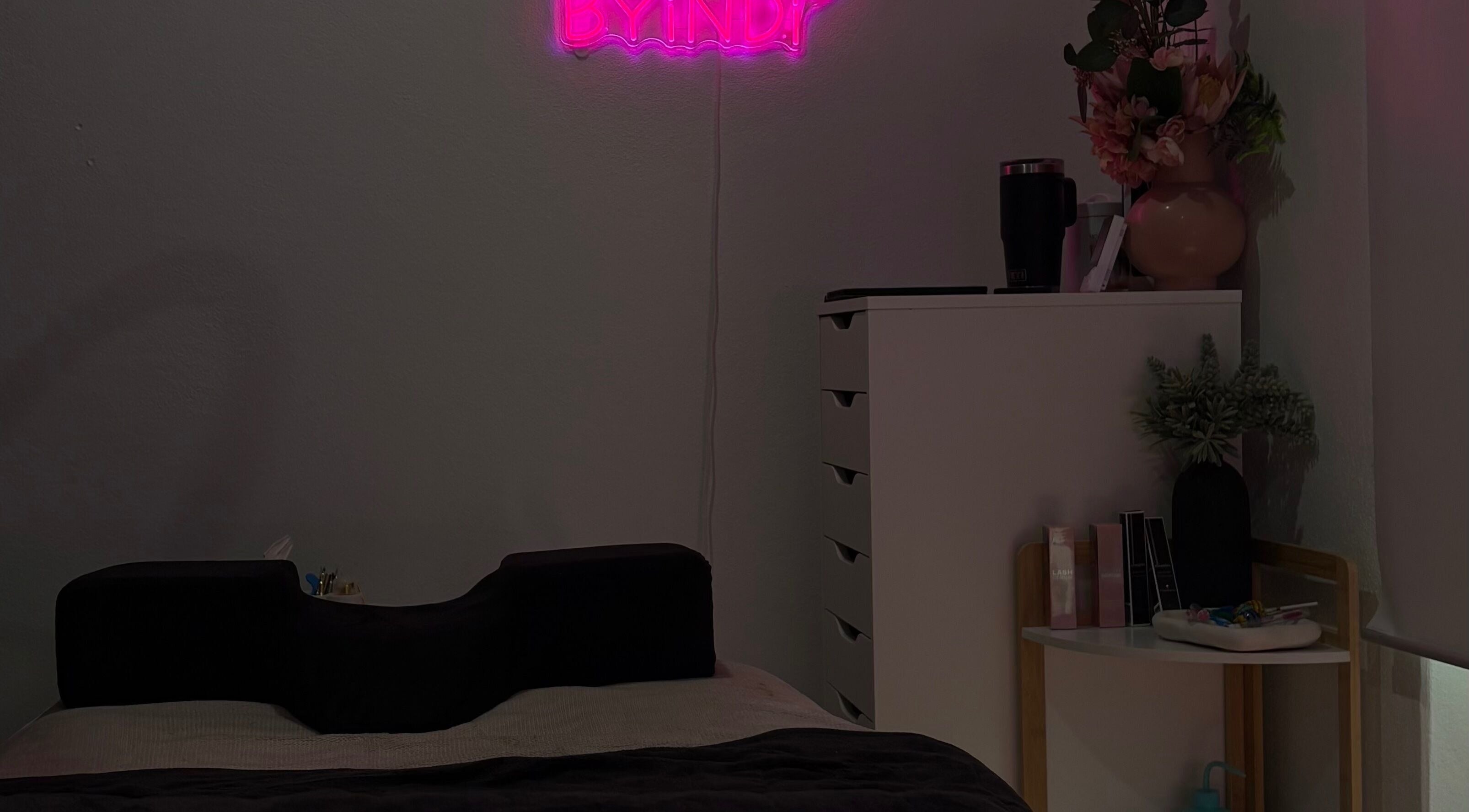 Relaxing beauty room at Beauty by Indi - Myaree, featuring neon decor and flowers, Myaree, Western Australia, AU.