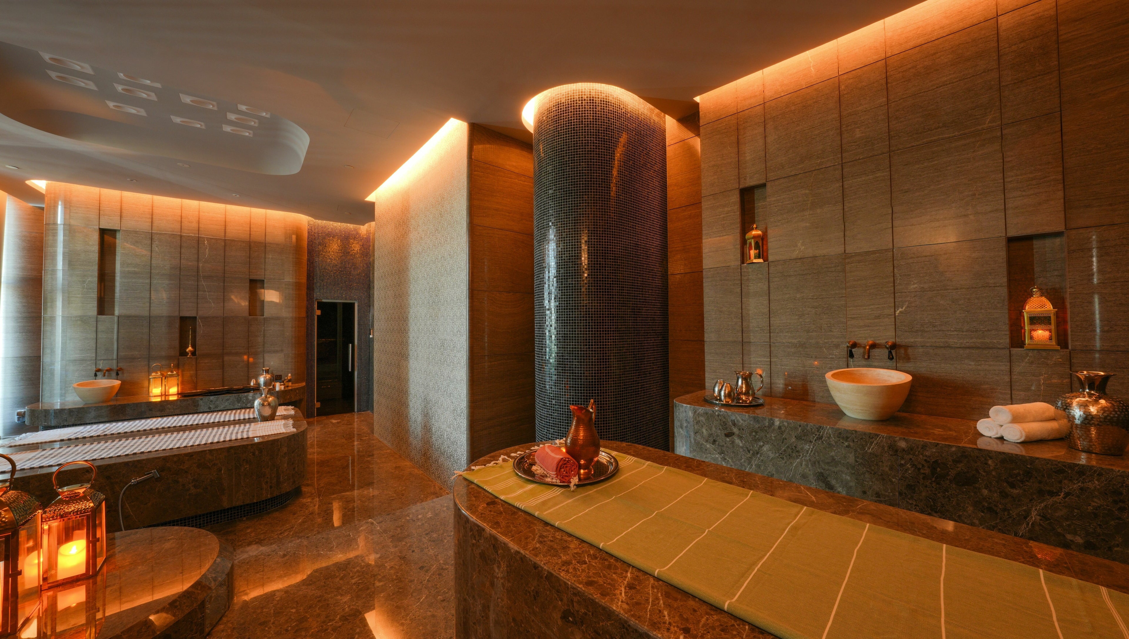 Luxurious spa at Wellbeings Holistic Healing, Marriott Jewel of the Creek, Dubai, AE with warm lighting.