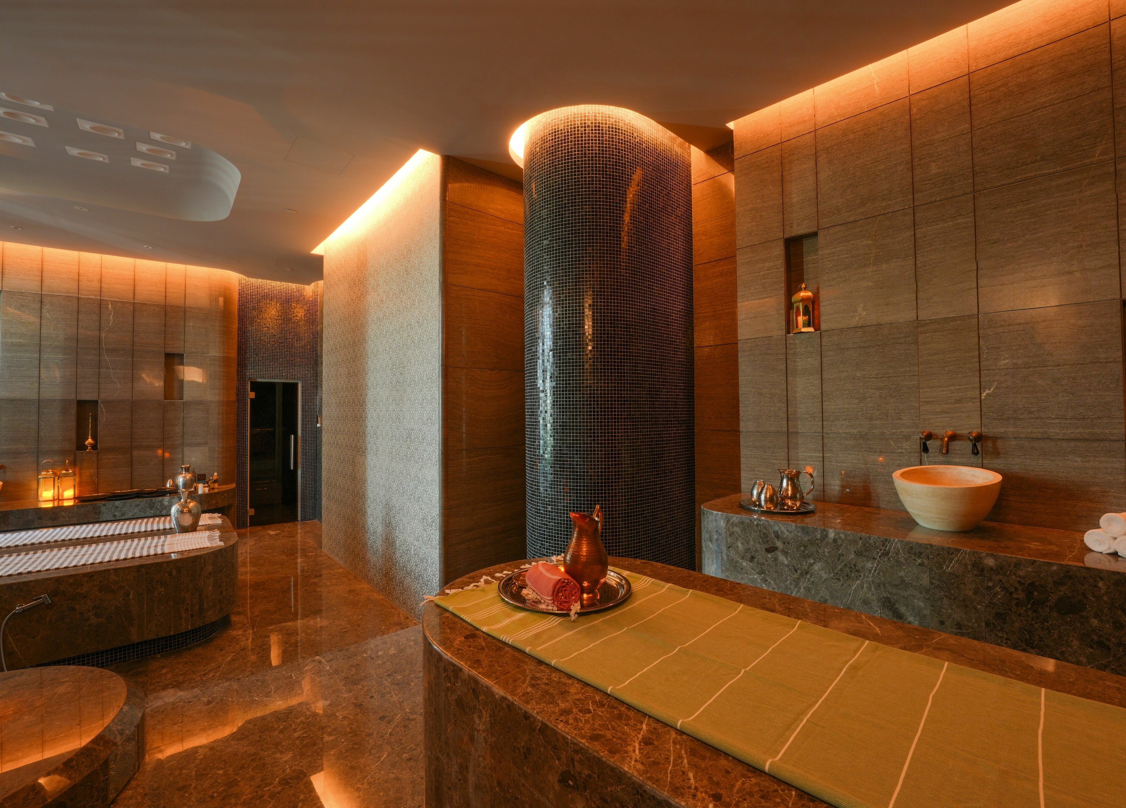 Luxurious spa at Wellbeings Holistic Healing, Marriott Jewel of the Creek, Dubai, AE with warm lighting.